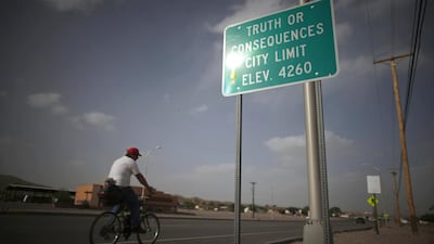 A man cycles into the town of Truth or Consequences, New Mexico. New Mexico taxpayers in 2007 agreed to pony up $225 million to fund the spaceport. Lucy Nicholson / Reuters