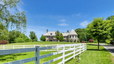 There's a riding ring, a 10-stall stable with apartment and tack room. Courtesy Douglas Elliman Realty