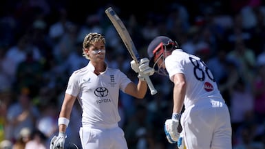 England’s Jacob Bethell celebrates after reaching his century on day four of the fifth Ashes Test in Sydney. AFP