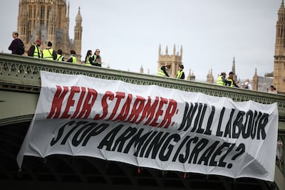 A banner questioning Labour's stance on the Israel-Gaza war is hung from Westminster Bridge in London on June 3 by campaigners. AFP