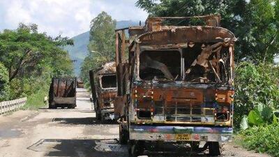 Vehicles burned out on National Highway 39 by protesters demanding a new district of Sardar Hills, who have imposed an economic blockade on the area.