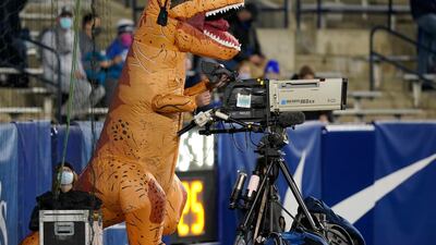 A cameraman dressed for Halloween operates a TV camera during an NCAA college football game between BYU and Western Kentucky, in Provo, Utah. AP Photo