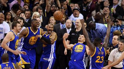 Stephen Curry #30 and the Golden State Warriors celebrate their 105 to 97 win over the Cleveland Cavaliers in Game Six of the 2015 NBA Finals at Quicken Loans Arena on June 16, 2015 in Cleveland, Ohio. NOTE TO USER: User expressly acknowledges and agrees that, by downloading and or using this photograph, user is consenting to the terms and conditions of Getty Images License Agreement. Jason Miller/Getty Images