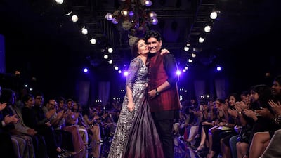 Manish Malhotra, right, with his muse and close friend, the Bollywood actress Kareena Kapoor. Chirag Wakaskar / Wire Image / Getty Images
