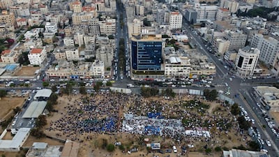 An aerial view taken by drone shows Palestinian Muslims perform the morning Eid al-Fitr prayer, marking the end of the holy fasting month of Ramadan in Gaza City. AFP