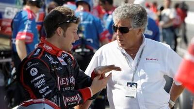 Marco Andretti, left, talks with his grandfather and former Indianapolis 500 winner Mario Andretti before the final practice session for the Indianapolis 500 race in May 2009.