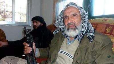 Syrian rebel commander Sheikh Azam Ajamar sits with a comrade in Bishqatin, 4 kilometres west of Aleppo, on Saturday. The rebels yesterday seized control of a sector of Sheikh Suleiman army base.