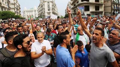 Demonstrators gesture and shout slogans during a protest rejecting Algerian election announcement for December, in Algiers, Algeria. REUTERS