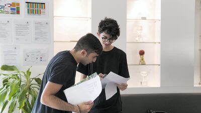 DUBAI, UNITED ARAB EMIRATES - AUG 17: Two students exchange their A-level examination results at Jumeirah College School. (Photo by Reem Mohammed/The National) Reporter: Caline Malek Section: NA