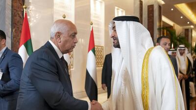 Sheikh Mohamed bin Zayed, Crown Prince of Abu Dhabi and Deputy Supreme Commander of the Armed Forces, greets a delegate accompanying Abdel Fattah El Sisi, President of Egypt (not shown), at the Presidential Airport. Mohamed Al Hammadi / Ministry of Presidential Affairs