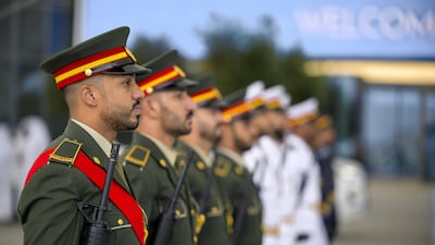 UAE Armed Forces honour guards participate in the welcome ceremony for the arrival of Sheikh Tamim