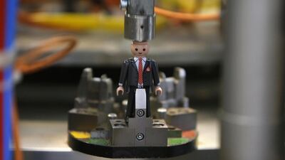 A Playmobil figure is assembled on the assembly line at the Playmobil Malta factory. Darrin Zammit / Reuters