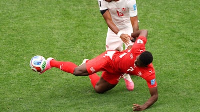 Breel Embolo of Switzerland is challenged by Derek Cornelius of Canada. AFP