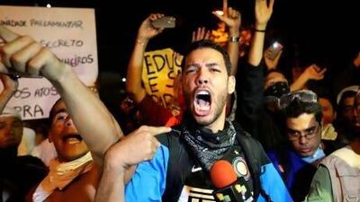 A demonstrator shouts during protests over excessive public spending for the Confederations Cup and next year’s World Cup, near the Maracana Stadium, in Rio de Janeiro.