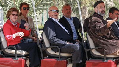 Queen Sonja of Norway, Queen Rania of Jordan, King Harald V of Norway, King Abdullah II of Jordan, and Prince Ghazi bin Muhammad (King Abdullah II's cousin and his chief advisor on religious and cultural affairs) ride together in a golf cart at the baptism site of al-Maghtas, where Jesus is believed by Christians to have been baptised by John the Baptist, on the Jordan river. AFP