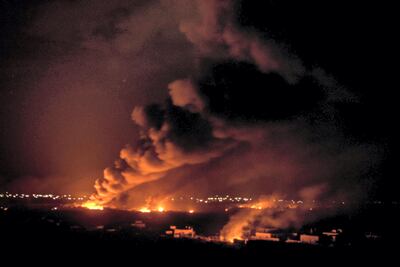 Fires burn inside the last ISIS redoubt in Baghouz, Syria. Campbell MacDiarmid / The National