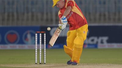 Former Australia batsman Dean Jones and the head coach of Islamabad United plays a shot. Aamir Qureshi / AFP