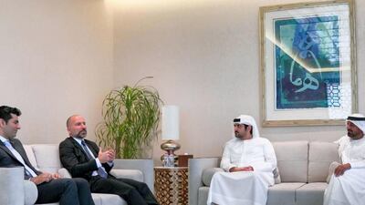 From left, Mudassir Sheikha and Dara Khosrowshahi, CEOs of Careem and Uber, speak to Sheikh Maktoum bin Mohammed, Deputy Ruler of Dubai, and Sheikh Ahmed Al Maktoum, the Emirates Group CEO. Dubai Media Office