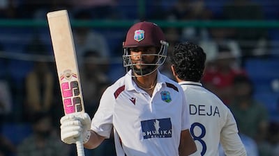 West Indies' Shai Hope celebrates reaching his 50. He ended the day unbeaten on 66. AP