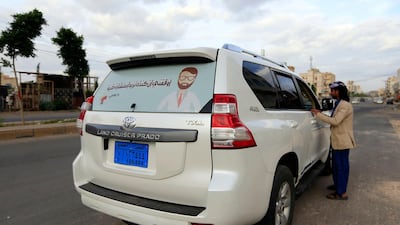 'Stop me if you need a medical consultation', reads a sticker on the rear window of Sami Yahya Al Hajj's car, alongside a cartoon figure of the bearded doctor wearing his square spectacles. AFP