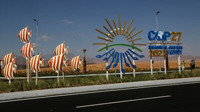 Signs promoting the Cop27 climate summit on Peace Road in Sharm El Sheikh, Egypt. AP