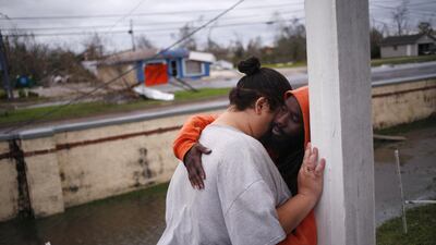 Residents embrace in front of an apartment building after Hurricane Michael hit in Panama City, Florida. Bloomberg