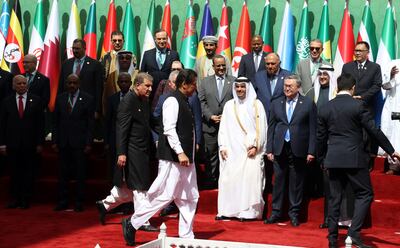 Prime Minister Imran Khan with delegates at the OIC meeting in Islamabad. EPA