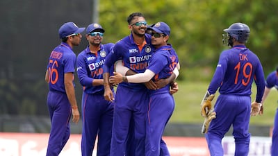 India bowler Axar Patel, centre, celebrates with his teammates after bowling West Indies' Shamarh Brooks during the fifth and final T20 n Lauderhill, Florida. AP