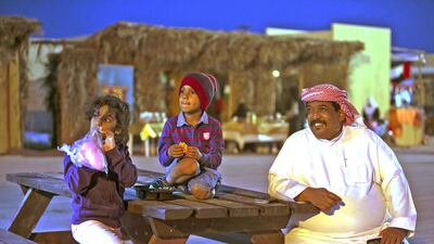 People enjoying the outdoors during their visit to the Zayed Heritage Festival. Silvia Razgova / The National
