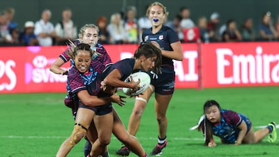 Dubai Warriors take on Dubai College during the Gulf Under-19 Girls final at the Emirates Dubai Sevens. Victor Besa / The National