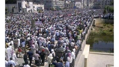 Protesters shout slogans during a demonstration against President Bashar al-Assad in the Syrian eastern town of Deir al-Zour, near the border with Iraq June 17, 2011. Syrian forces shot dead 16 people on Friday when they fired on protesters demanding the removal of President Bashar al-Assad, activists said, and European powers said Damascus should face tougher sanctions for the violence.