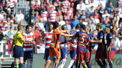 Players argue during the La Liga match between Granada and Barcelona at Estadio Nuevo Los Carmenes on May 14, 2016 in Granada, Spain. (Photo by Denis Doyle/Getty Images)