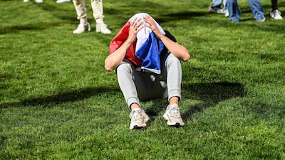 French supporters react in a fan zone at a stadium in Gerland, near Lyon. AFP