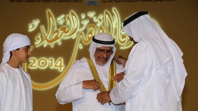 Ateeq Al Qemzi receives an award to mark his 50 years of service at Adco in a ceremony at the Emirates Palace this month. The pioneer oilman has a formidable reputation within the industry. Courtesy Adco