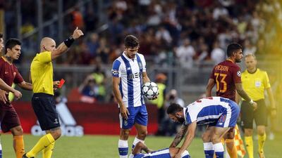 Roma's Emerson Palmieri, right, is sent off after a receiving a red card. Angelo Carconi / EPA