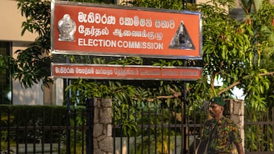 A Special Task Force soldier guards the Election Commission as the presidential election results are announced. Bloomberg
