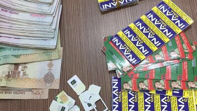 Police in Dubai have recovered sim cards used by alleged fraudsters in a series of raids