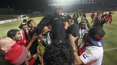 UAE players and staff celebrate after beating Uzbekistan 3-2 to qualify for the Olympics in Uzbekistan. Sammy Dallal / The National