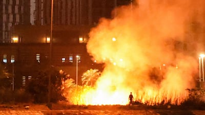A fire burns on the grounds of the US Embassy in Baghdad’s fortified Green Zone following a drone and rocket attack on Tuesday. AFP