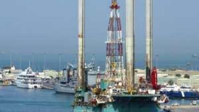 Oil rigs moored at Port Zayed. Horizontal drilling may yield more oil from some fields.