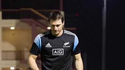 Ben Smith of New Zealand sevens watches an Exile junior tackles the pads. Duncan Chard for The National