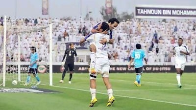 Al Ain FC celebrates a score at a recent Pro League football game in Al Ain. Anas Kanni / Al Ittihad