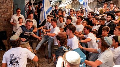Israeli right-wing nationalists attack Palestinian journalist Saif Al Qawasmi in the Old City of Jerusalem during the Flag March. AFP