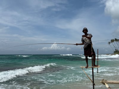 The fishermen sit on stilts and use fishing rods made of local wood to catch small fish. Taniya Dutta / The National