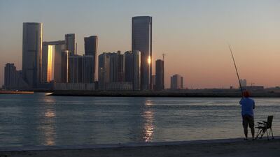A lone fisherman angles for a catch as the sun sets. DELORES JOHNSON / The National