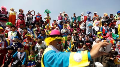 A clown takes a selfie in front of other clowns during the 22nd Latin American clown convention at Revolucion monument in Mexico City, Mexico. Edgard Garrido / Reuters