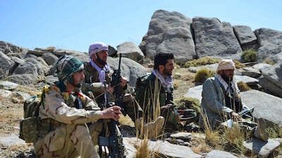 Fighters for the anti-Taliban forces rest during a patrol in the Anaba district of Afghanistan's Panjshir province. Taliban men and fighters loyal to local leader Ahmad Massoud fought in the valley on September 2. AFP