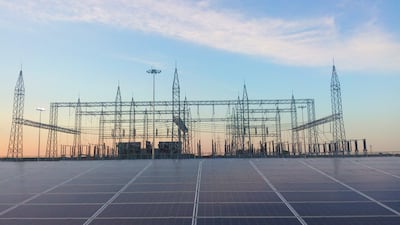 Abu Dhabi's IHC is investing about $2bn in India's Adani Group's green-focused companies. Adani’s 648MW solar project in Tamil Nadu, pictured, is part of India’s plan to add 100GW of solar power by 2022. Photo: ABB