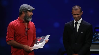 Former French international Eric Cantona, left, receives the Uefa President's Award. AFP
