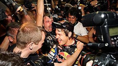 Vettel, seen here after winning the title last year in Abu Dhabi, does not think his crown will give him an advantage.